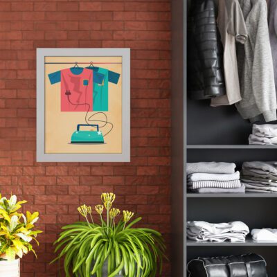 Laundry room wall art featuring a red and green hanging shirt with an iron on a light brown background, designed with red, teal, and green colors. hung on the wall nearby cupboard