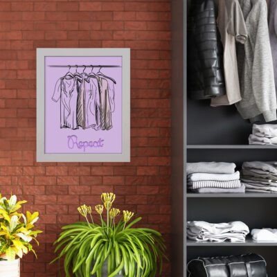 Laundry room wall art with "Repeat" in cursive purple text on a light purple background, featuring a minimalist sketch of shirts on a clothing rack. hung on the wall and nearby cupboard