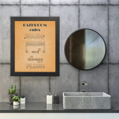 BATHROOM rules WASH, BRUSH and always FLUSH bathroom wall art with bold fonts and a warm orange background. hung on the wall in the bathroom a black frame