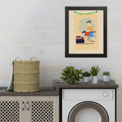 Laundry room wall art featuring a person folding clothes at a table, with orange, blue, green, and gray colors on a light beige background. hung on the wall the laundry wall art under the washing machine