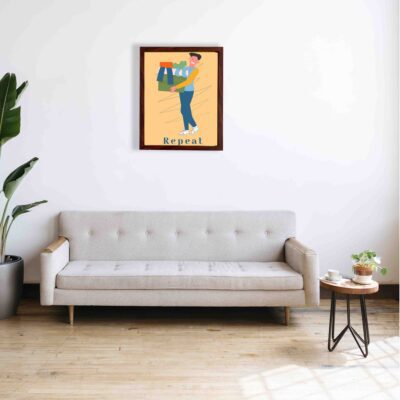 Laundry room wall art with "Repeat" in dark blue text on a beige background, featuring a cartoon-style man carrying a basket of folded laundry. a sofa below the wall art.