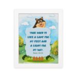 Cheerful dog character with Psalm 119:105 verse Your Word is like a lamp for my feet on a bright blue background. hung on the wall in a white frame