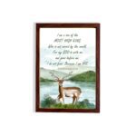 The lakeside scene with a deer and mountains features the verse I Am A Son Of The Most High King in calming colors. hung on the wall in a brown frame