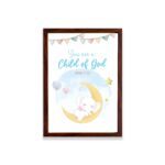 You Are a Child of God wall art featuring a white elephant on a crescent moon with stars and pastel flags. hung on the wall in a brown frame