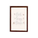 Cook Sing Dance kitchen wall art with pastel pink tones, a beige background, and musical notes.