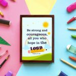 Be Strong And Courageous Psalm 31:24 Bible Verse Wall Art with sun and stars on a sky blue background for kids. displayed on the wall in a brown frame in a colorful background