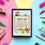 Bible verse wall art for kids with Matthew 11:28 and cartoon animals on a light blue background. displayed on the wall in a brown frame in a colorful background