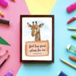 Jeremiah 29:11 Bible verse wall art featuring a cheerful giraffe on a sky-blue background, designed for children's rooms. displayed on the wall in a brown frame in colorful background