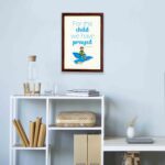 For This Child, We Have Prayed 1 Samuel 1:27 Bible Verse Wall Art with a child on blue bird illustration displayed on the wall in a brown frame