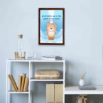 God Holds Me In The Palm Of His Hand Isaiah 49:16 Bible verse wall art for kids featuring a cartoon bear and fluffy clouds. hung on the wall in a brown frame