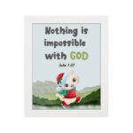 Wall art for kids featuring a happy cat in a Santa outfit holding a gift with the text Nothing is impossible with God. hung on the wall in a black frame