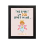 Infidu wall art featuring a cute angel with pink wings and a light blue dress, with the text The Spirit of God lives in me above. hung on the wall in a black frame