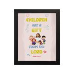 Christian wall art with happy children holding hands and Psalm 127:3 text 'Children are a gift from the Lord. hung on the wall in a black frame