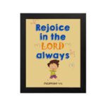 Rejoice in the Lord always, Philippians 4:4 Christian wall art with smiling child and bright colors. hung on the wall in a black frame