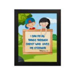 Colorful wall art featuring children and the verse I Can Do All Things Through Christ Who Gives Me Strength. hung on the wall in a black frame