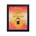 Colorful wall art featuring a happy child holding a heart with the quote You Are Loved Beyond Measure and Romans 8:38. hung on the wall in a black frame