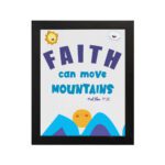 Wall art with the text Faith can move mountains from Matthew 17:20, featuring a sun rising over mountains. hung on the wall in a black frame