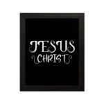 Jesus Christ wall art in white curly font on a black background, showcasing elegant Christian design. hung on the wall in a black frame