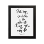 Wall art featuring the quote 'Getting wisdom is the wisest thing you can do' from Proverbs 4:7 on a white background. hung on the wall in a black frame