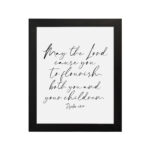 Elegant wall art featuring Psalm 115:14 in cursive font, black text on a white background. Wall Art hung on the wall in a black frame