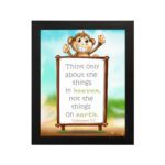 Wall art featuring a happy monkey holding a sign with the verse 'Think only about the things in heaven' from Colossians 3:2. hung on the wall in a black frame