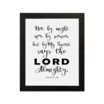 Not By Might Nor By Power Zechariah 4:6 Christian wall art with black text on a white background. hung on the wall in a black frame