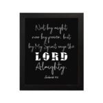 Not By Might Nor By Power Zechariah 4:6 Christian wall art with white text on a black background. hung on the wall in a black frame