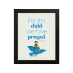 For This Child, We Have Prayed 1 Samuel 1:27 Bible Verse Wall Art with a child on blue bird illustration hung on the wall in a black frame