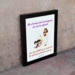 Be Strong and Courageous Joshua 1:9 Bible verse wall art featuring Jesus and two children with a soft blue background. displayed on the wall in a black frame