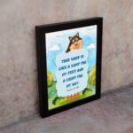 Cheerful dog character with Psalm 119:105 verse Your Word is like a lamp for my feet on a bright blue background. displayed on the wall in a black frame