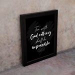 For With God, Nothing Shall Be Impossible Luke 1:37 Christian Bible Verse Wall Art on black background with bold white text. displayed on the wall in a black frame