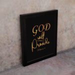 Infidu wall art with the text "GOD will provide" in gold font on a black background, referencing Philippians 4:19. displayed on the wall in a black frame