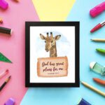 Jeremiah 29:11 Bible verse wall art featuring a cheerful giraffe on a sky-blue background, designed for children's rooms. displayed on the wall in a black frame in colorful background