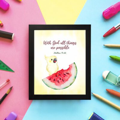 With God, All Things Are Possible Matthew 19:26 Bible Verse Wall Art featuring a bird and watermelon design for kids. displayed on the wall in a black frame in colorful background