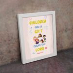 Christian wall art with happy children holding hands and Psalm 127:3 text 'Children are a gift from the Lord. displayed on the wall in a white frame