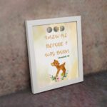 Artwork of a baby deer with flowers and the verse God knew me before I was born in warm colors. Perfect for children's decor. displayed on the wall in a white frame