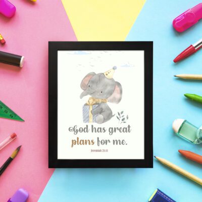 Wall art featuring a grey elephant with a party hat and a yellow gift, displaying the text God Has Great Plans For Me. displayed on the wall in a black frame in a colorful background