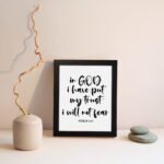 Christian wall art with Psalm 56:4 text on a white background. displayed on the wall in a black frame