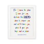 Colorful wall art featuring Jeremiah 29:11, For I Know The Plans I Have For You, with rainbow text on a white background. hung on the wall in a white frame