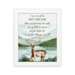 The lakeside scene with a deer and mountains features the verse I Am A Son Of The Most High King in calming colors. hung on the wall in a white frame