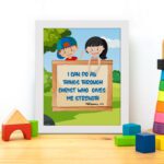 Colorful wall art featuring children and the verse I Can Do All Things Through Christ Who Gives Me Strength. displayed on the table in a white frame