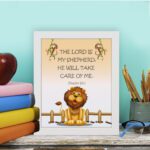 Friendly lion illustration with the verse The Lord is my shepherd, he will take care of me on a light peach background. displayed on the table in a white frame