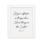 Set Your Affection on Things Above Colossians 3:2 Bible Verse Wall Art on a white background with black text and leaf decorations. hung on the wall in a white frame