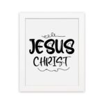 Jesus Christ wall art in black curly font on a white background, showcasing elegant Christian design. hung on the wall in a white frame