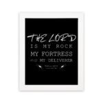 Bible wall art featuring Psalm 18:2 with the text The Lord is my rock, my fortress, and my deliverer in bold and cursive fonts. hung on the wall in a white frame