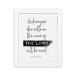 Bible wall art featuring Acts 2:21 with THE LORD highlighted in a black brushstroke on a white background. hung on the wall in a white frame