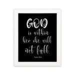 God Is Within Her, She Will Not Fall Psalm 46:5 Bible verse wall art in white text on a black background. hung on the wall in a white frame