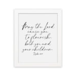 Elegant wall art featuring Psalm 115:14 in cursive font, black text on a white background. Wall Art hung on the wall in a white frame