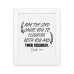 May The Lord Cause You To Flourish Both You And Your Children Psalm 115:14 Christian Wall Art with black text on white background. hung on the wall in a white frame