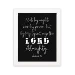 Not By Might Nor By Power Zechariah 4:6 Christian wall art with white text on a black background. hung on the wall in a white frame